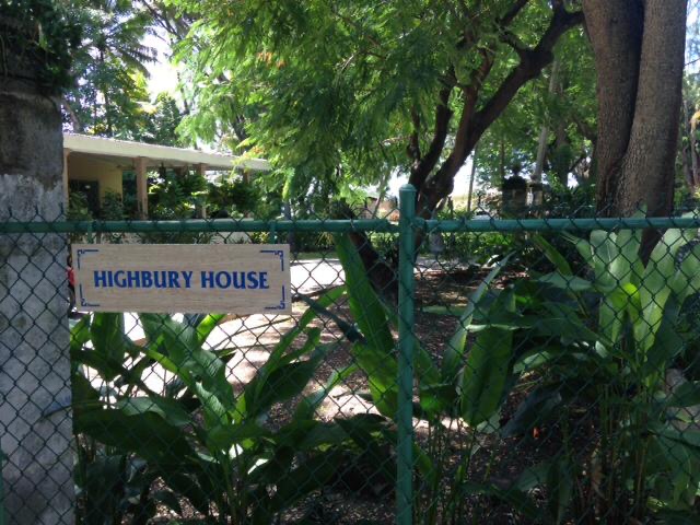 Photo showing the Highbury House sign leading to the Sunshine Kula yoga studio in Barbados.